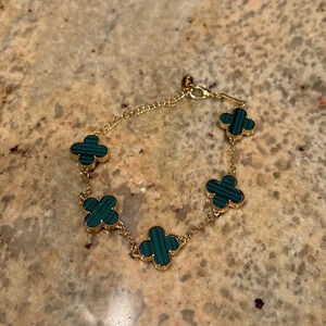 Gold plated green and black four leaf clover bracelet